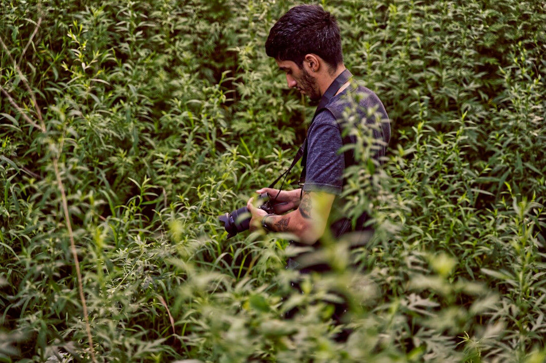 farmer checking crops with drone